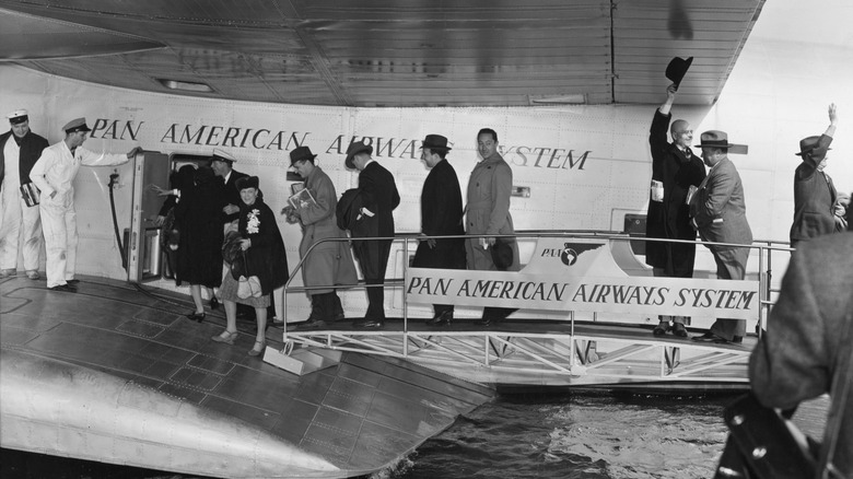 A black and white photo of passengers boarding one of Pan American Airway's so-called flying boats