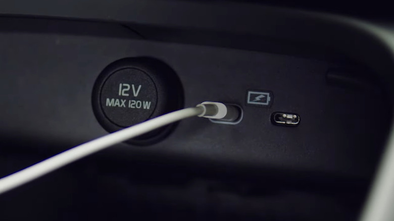 USB C charging ports in car with cable connected
