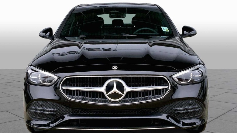 Black Mercedes-Benz C300 in front of a plain white background