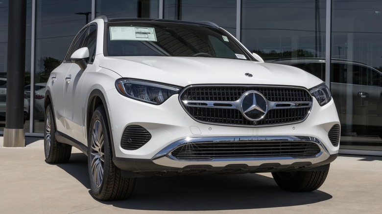 White Mercedes-Benz GLC on display in front of a dealership