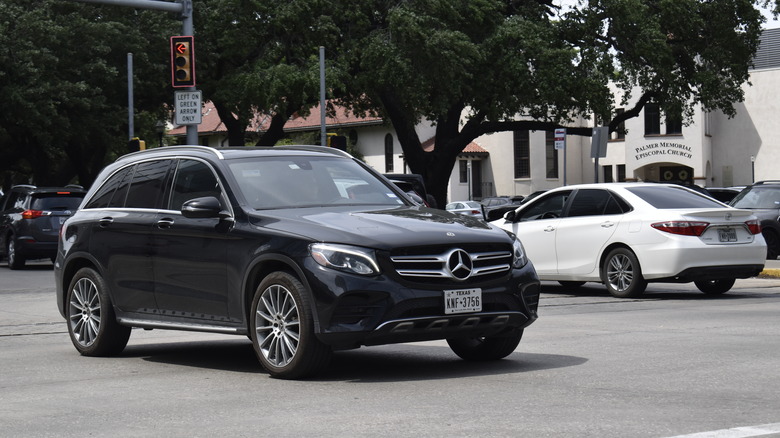 Black Mercedes-Benz GLC in traffic