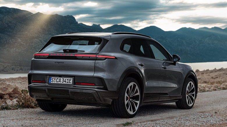 Porsche Cayenne Electric parked near mountains
