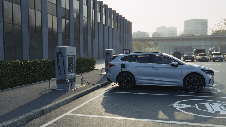 Electric car plugged in at charging dock