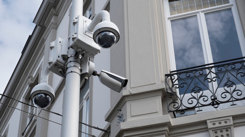 Several security cameras in an urban environment.
