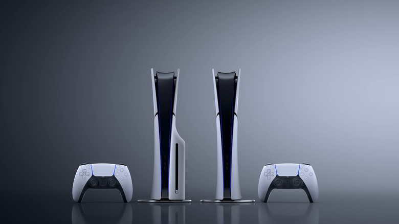 Two white PlayStation 5 Slim consoles with DualShock controllers.