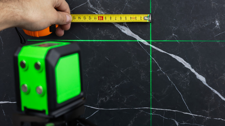 Green laser level projecting on a wall