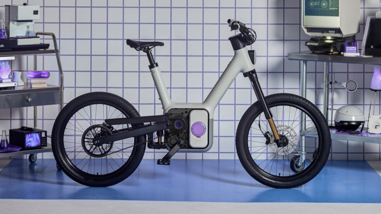 Also TM-B e-bike side view inside a fake workshop