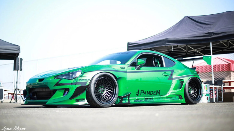 green Subaru BRZ Rocket Bunny V3 parked in paddock