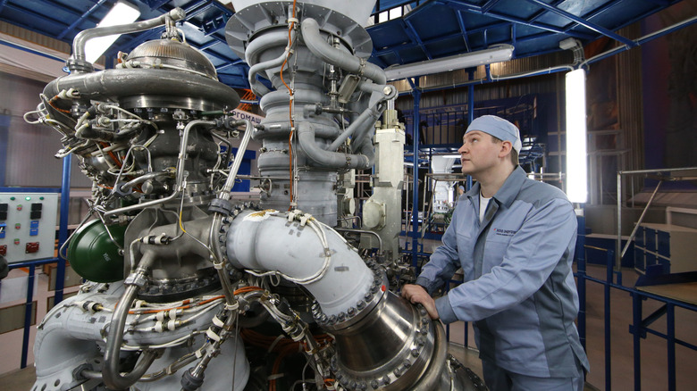 Russian engineers work with the rocket engine at NPO Enegromash, a major Russian rocket manufacturer in Khimki,