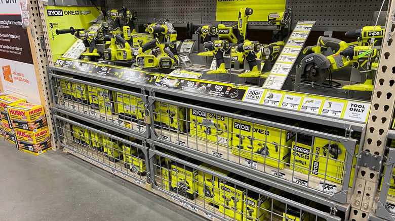 A selection of Ryobi Tools, with packages locked away, at home improvement retailer Home Depot.