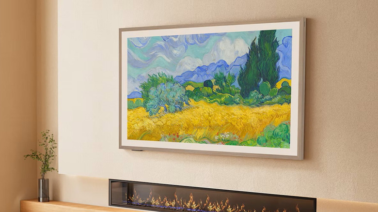 A Hisense Canvas TV on a wall displaying a Van Gogh painting