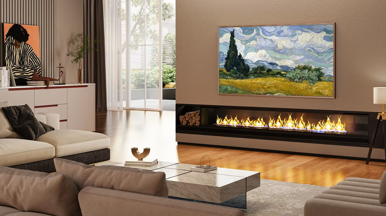 A Hisense Canvas TV in a living room above a fireplace