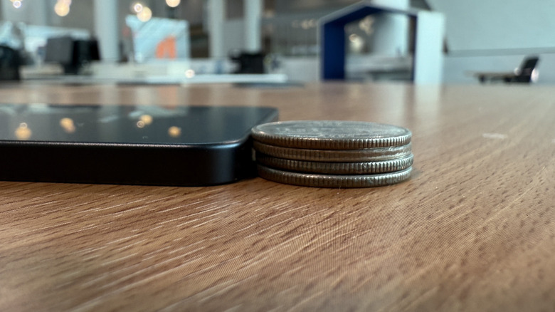 Samsung Galaxy S25 Edge next to a stack of quarters