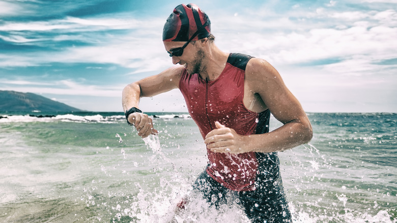 triathlon runner checking watch