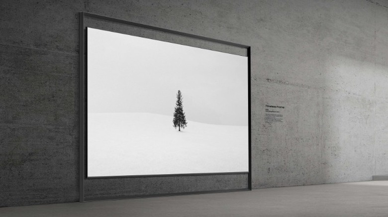 Samsung's 130-inch Micro RGB TV against a concrete wall.