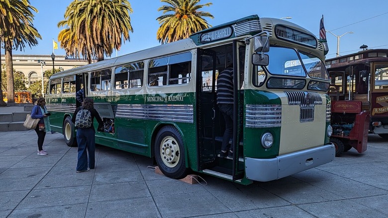 Twin Coach 44-D bus (fleet number 0163) parked at an event.