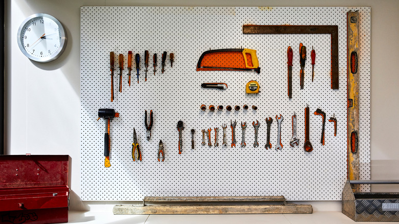 Tools hanging from a pegboard