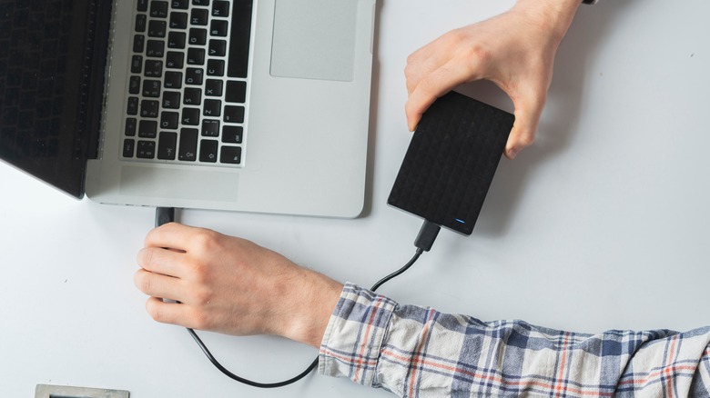 Plugging an external hard drive into a laptop