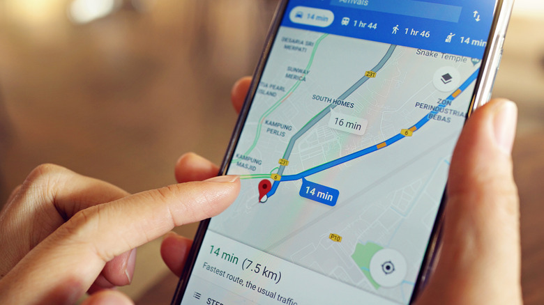A woman uses Google Maps on an Android phone