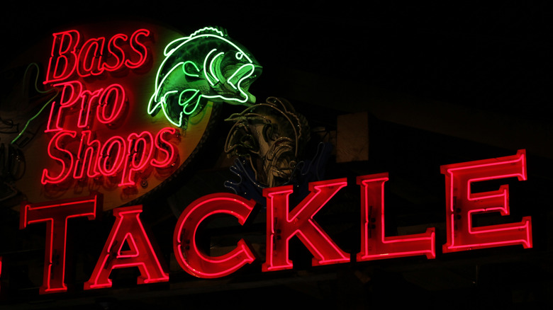 A neon Brass Pro Shops sign lights up the sky in Tyler, Texas.