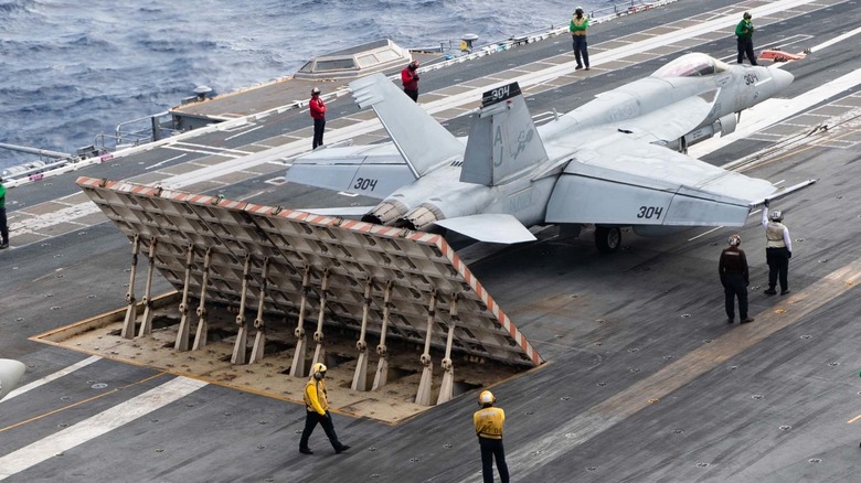 An F/A-18E Super Hornet preparing to launch via EMALS on the USS Gerald R. Ford (CVN-78)