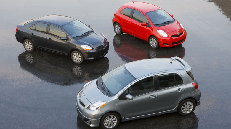 2009 - 2011 Toyota Yaris sedan, 3-door liftback, and 5-door liftback parked together