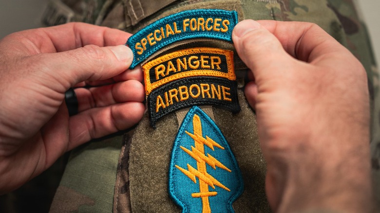 A soldier receives the Special Forces tab on their uniform.