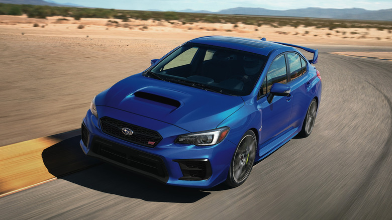 2020 Subaru Impreza WRX STI driving on Willow Springs Raceway, front-left 3/4 view