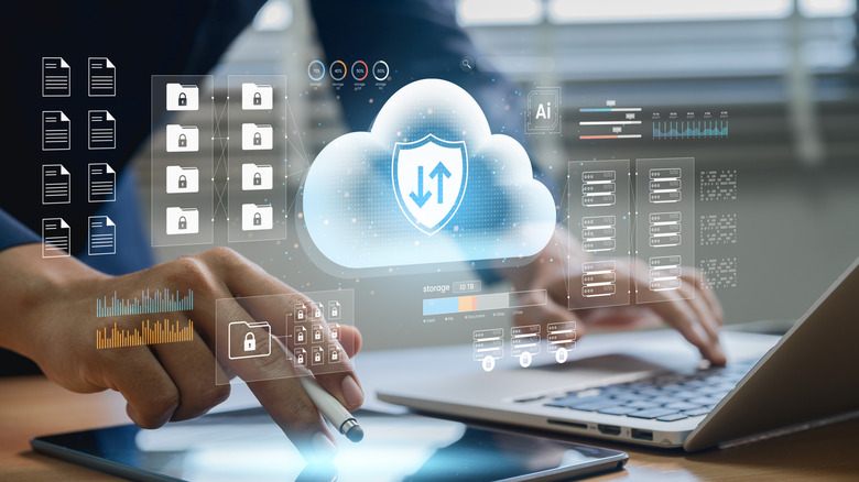 Person using a laptop and a tablet, with cloud service imagery overlaid on top