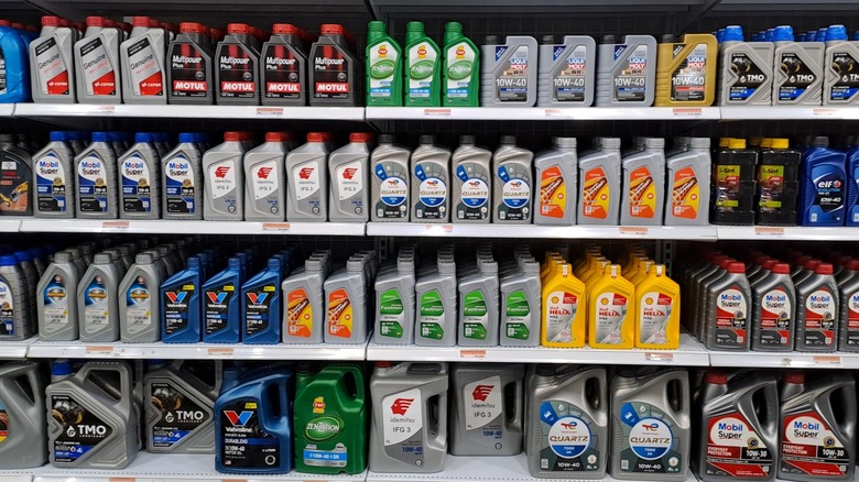 An shelf full of engine oil bottles