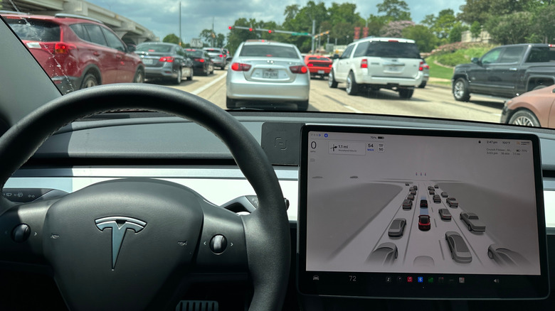 Tesla car running FSD Software