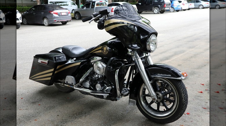 Harley-Davidson Street Glide Ultra in foreground of a parking lot