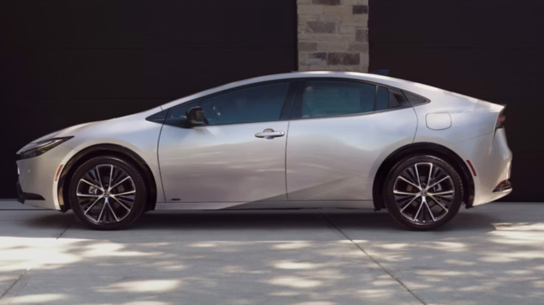 A silver Toyota Prius parked in a driveway