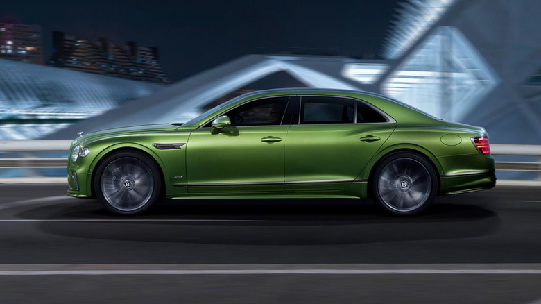 A green Bentley Flying Spur on a bridge