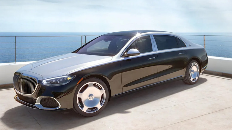 A Mercedes Benz Maybach parked by an ocean