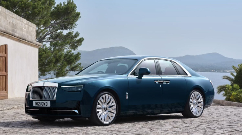 The Rolls Royce Ghost parked by a lake