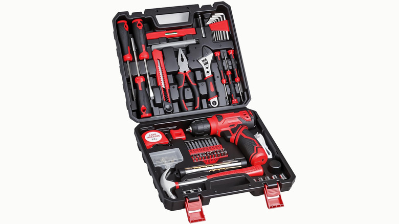 black and red Prekull tool case with hand tools and a drill inside