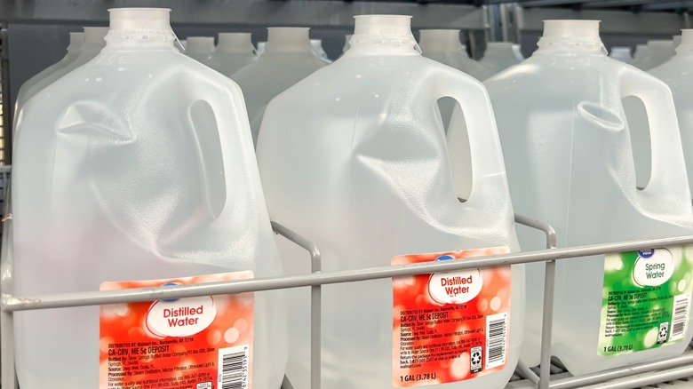 bottles of distilled water on a shelf