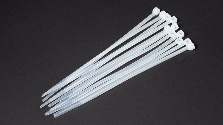 Zip ties on a black surface