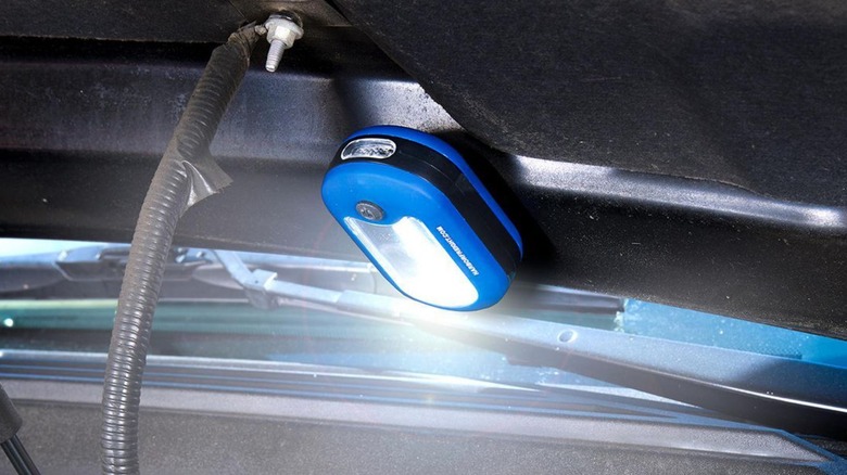Harbor Freight flashlight in an engine bay