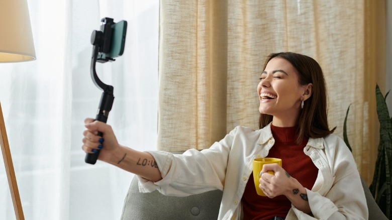 Woman filming a vlog with a phone