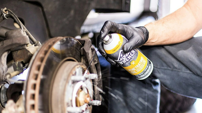 Liquid Wrench being used on rusted bolt