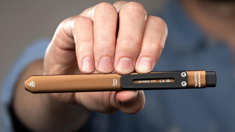 Person holding Streamlight Wedge SL flashlight