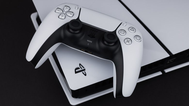 A PlayStation 5 controller resting on a PS5 console.