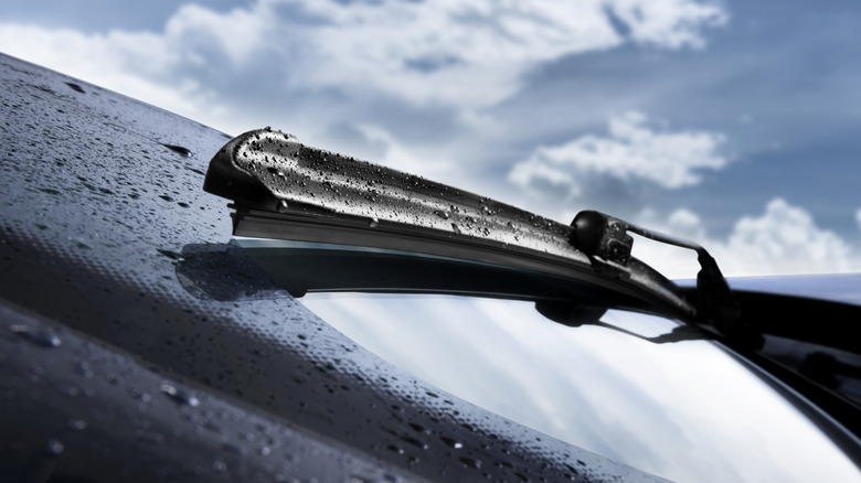 Windshield wiper blade clearing a windshield