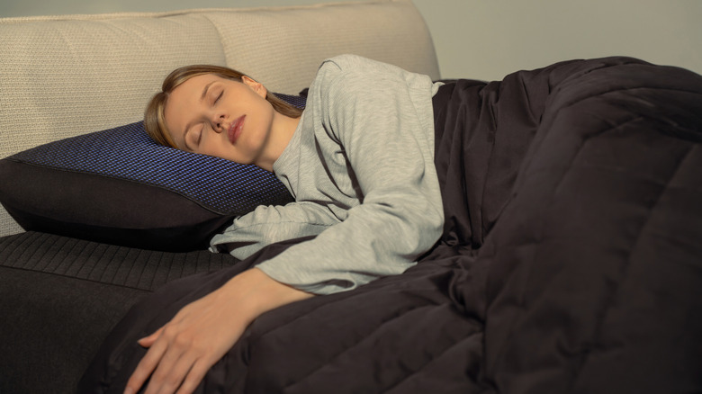 Woman sleeping on Eight Sleep pod system