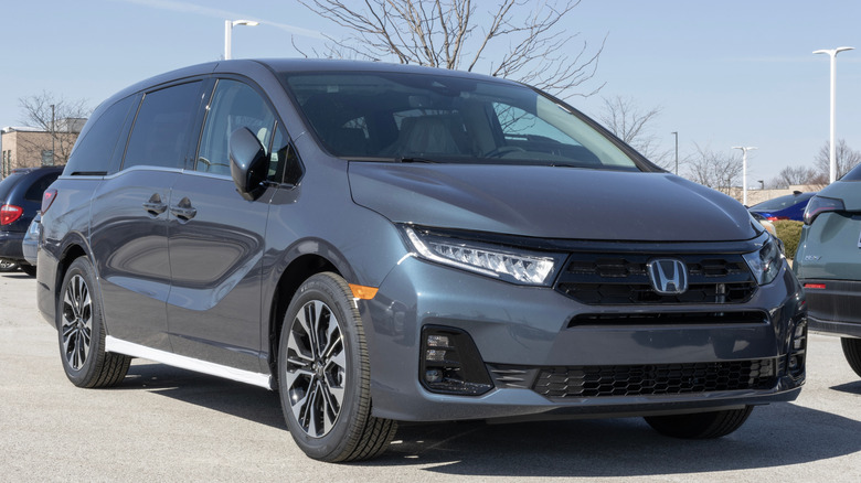 Grey Honda Odyssey minivan on a parking lot