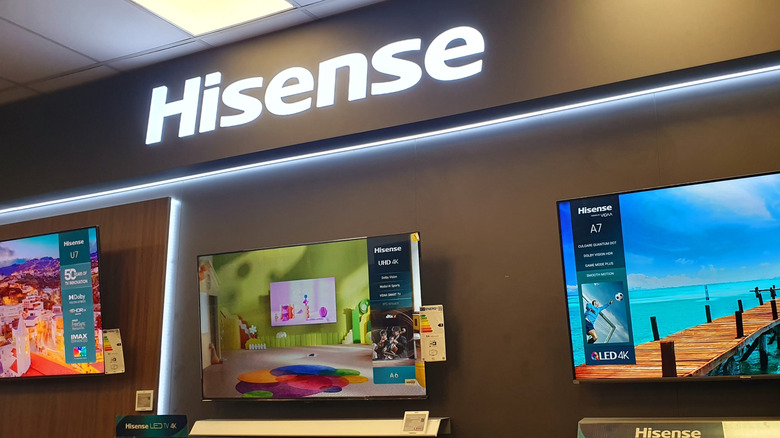 hisense logo and tvs in an electronics store