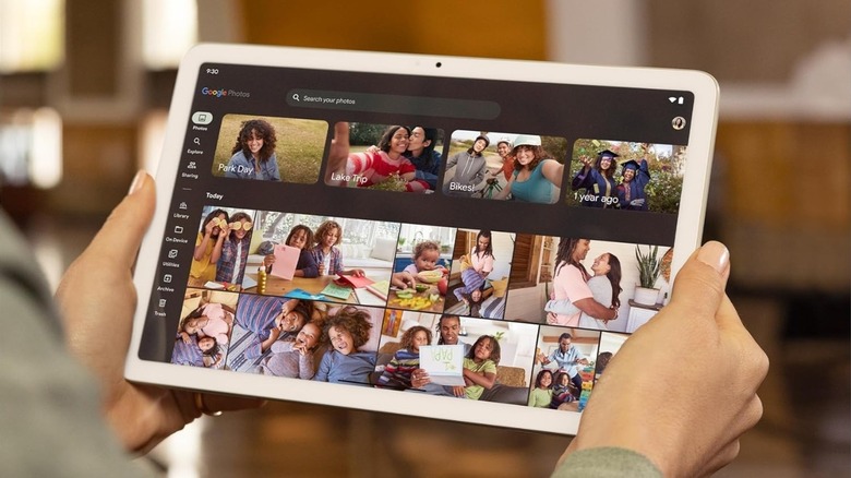 A person using the Photos app on a Google Pixel Tablet.