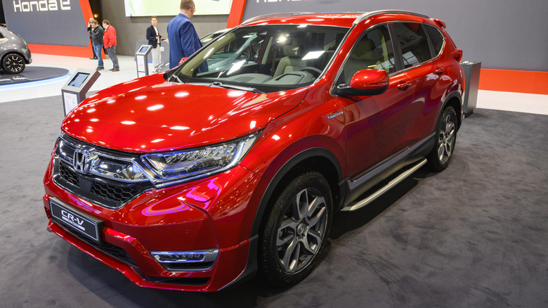 A red Honda CR-V on display at an auto show